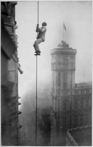The Human Squirrel who did many daring stunts in climbing for benefit of War Relief Funds in New York City. He is sh - NARA - 533754 photo