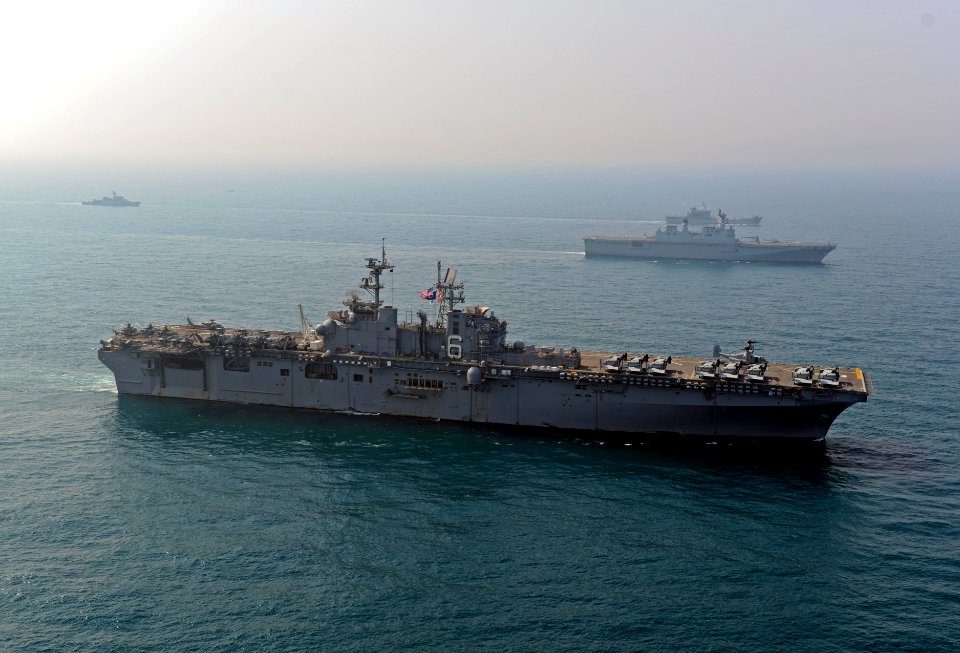 The amphibious assault ship USS Bonhomme Richard (LHD 6), front, transits the East China Sea with the South Korean amphibious assault ship ROKS Dokdo (LPH 6111) during a photo exercise with other ships assigned 140327-N-BJ178-569
