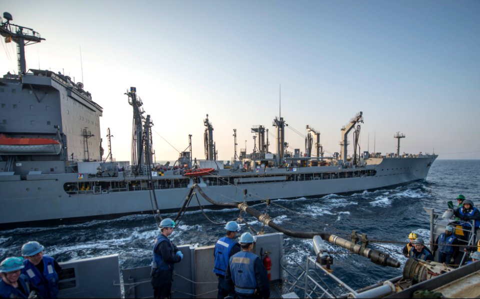 The amphibious transport dock ship USS Denver (LPD 9), front, prepares to receive fuel during a replenishment at sea with the fleet replenishment oiler USNS Rappahannock (T-AO 204) in the East China Sea 140327-N-ZU025-063