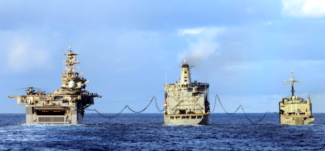 The amphibious assault ship USS Bonhomme Richard and the Royal Australian Navy amphibious ship HMAS Kanimbla refuel from the Military Sealift Command fleet replenishment oiler USNS Guadalupe