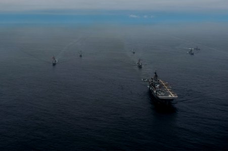 The amphibious assault ship USS America (LHA 6), right front, and Peruvian Navy ships sail in formation during a passing exercise in the Pacific Ocean Sept 140903-N-MZ309-1244