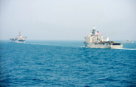 The amphibious assault ship USS Bonhomme Richard (LHD 6), left, the amphibious dock landing ship USS Ashland (LSD 48) and other ships assigned to the Bonhomme Richard Amphibious Ready Group are underway with 140327-N-ZU025-127