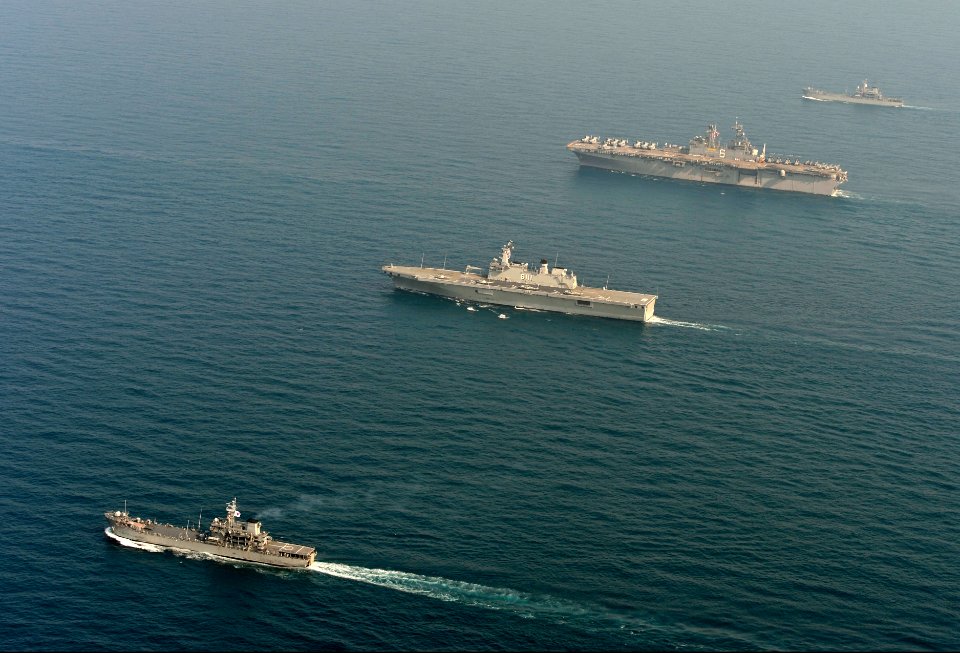 The amphibious assault ship USS Bonhomme Richard (LHD 6), second from top right, transits the East China Sea with Republic of Korea Navy ships during a photo exercise March 27, 2014 140327-N-BJ178-271