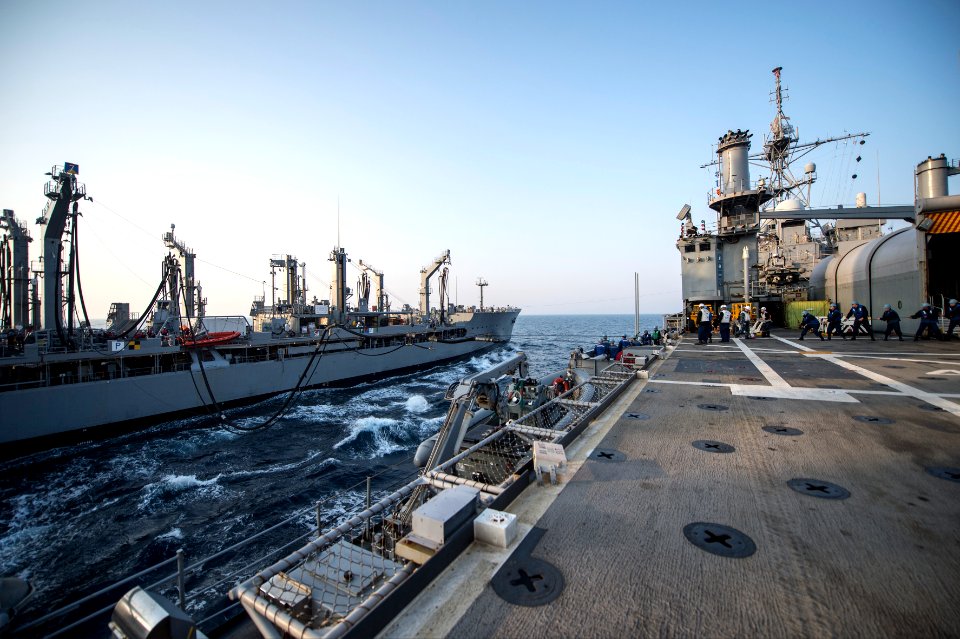 The amphibious transport dock ship USS Denver (LPD 9), right, prepares to receive fuel during a replenishment at sea with the fleet replenishment oiler USNS Rappahannock (T-AO 204) in the East China Sea 140327-N-ZU025-048