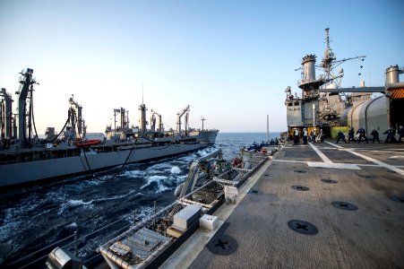 The amphibious transport dock ship USS Denver (LPD 9), right, prepares to receive fuel during a replenishment at sea with the fleet replenishment oiler USNS Rappahannock (T-AO 204) in the East China Sea 140327-N-ZU025-048