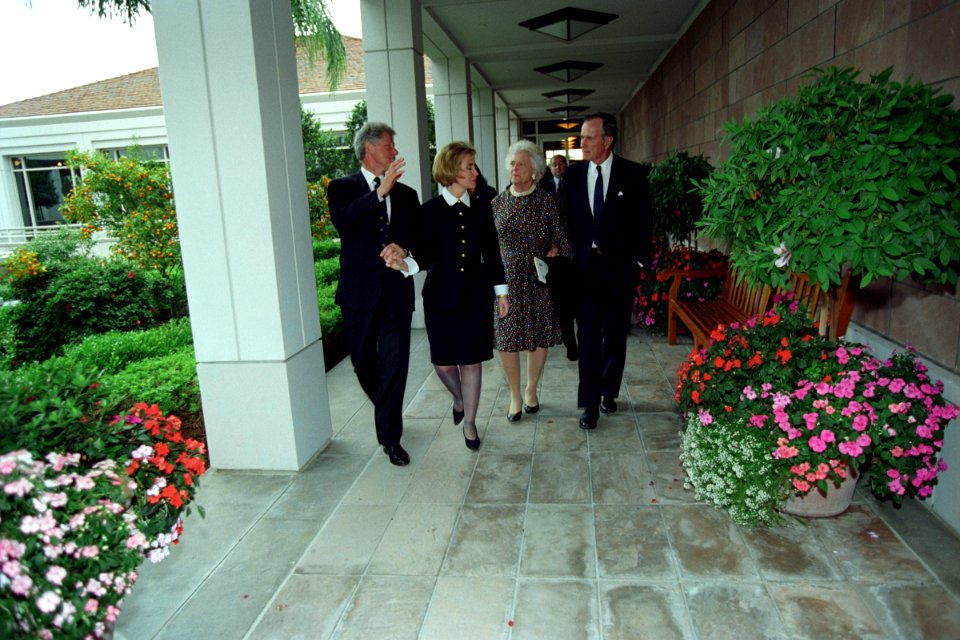 The Clintons walking with President George H. W. Bush and Barbara Bush following President Nixon's funeral (additional view)