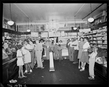 The company store is as much a gathering and visiting spot as it is a shopping place. Gilliam Coal and Coke Company... - NARA - 540818 photo