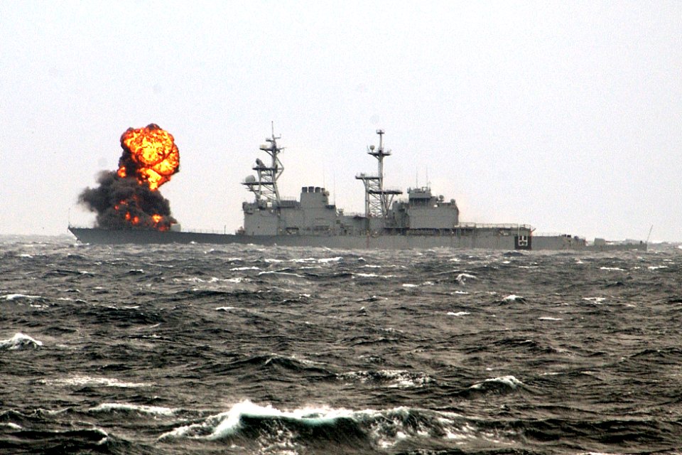 The decommissioned destroyer Hayler (DD 997) takes fire during a sinking exercise