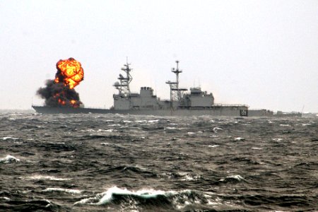 The decommissioned destroyer Hayler (DD 997) takes fire during a sinking exercise