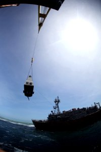 The ehaust funnel of USS Guardian is craned away for salvage. (8515022043)