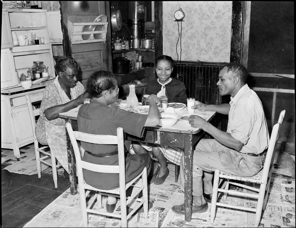 The family of John R. Blaney eating supper. Mr. Blaney has worked for the company for twenty-four years. Mullens... - NARA - 540956