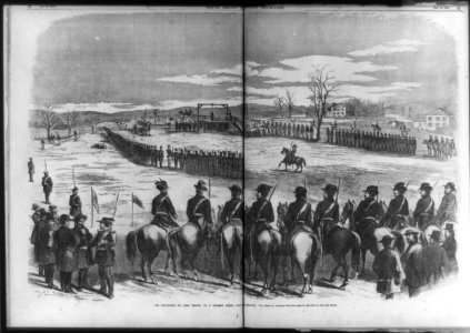 The execution of John Brown, in a stubble field, near Charleston, (W.) Va. (men on horseback in foregrd.) LCCN99614009