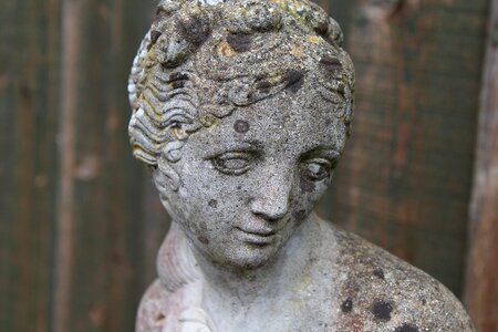Stone face thinking woman monument
