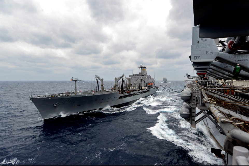 The fleet replenishment oiler USNS Rappahannock (T-AO 204), left, conducts a replenishment at sea with the amphibious assault ship USS Bonhomme Richard (LHD 6) in the East China Sea March 7, 2014 140307-N-BJ178-067