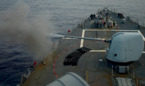 The forward Mark 45 5-inch gun aboard the guided missile destroyer USS Ramage (DDG 61) fires during a live-fire exercise in the Mediterranean Sea Feb. 23, 2014 140223-N-CH661-001