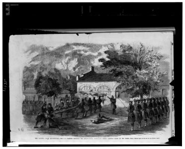 The Harper's Ferry insurrection-The U.S. Marines storming the engine house-Insurgents firing through holes in the doors - from a sketch made on the spot by our special artist. LCCN00652046