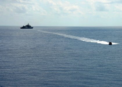 The guided missile destroyer USS Ramage (DDG 61) conducts small boat operations with the Greek frigate HS Salamis (F 455) in the Mediterranean Sea April 9, 2014, in support of Noble Dina 2014 140409-N-CH661-661