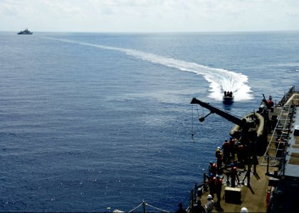The guided missile destroyer USS Ramage (DDG 61) conducts small boat operations with the Greek frigate HS Salamis (F 455) in the Mediterranean Sea April 9, 2014, in support of Noble Dina 2014 140409-N-CH661-669