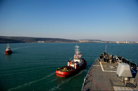 The guided missile destroyer USS Truxtun (DDG 103), right, pulls into Varna, Bulgaria, March 13, 2014 140313-N-EI510-062