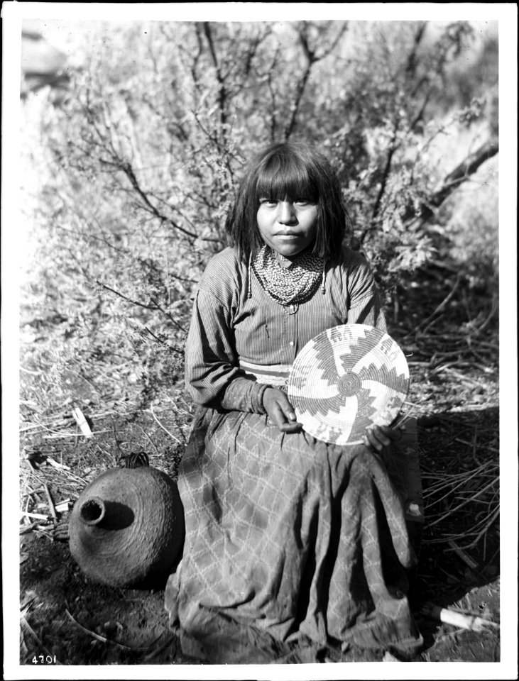The Havasupai Indian Waluthama's daughter showing basket she made, ca.1900 (CHS-4701)
