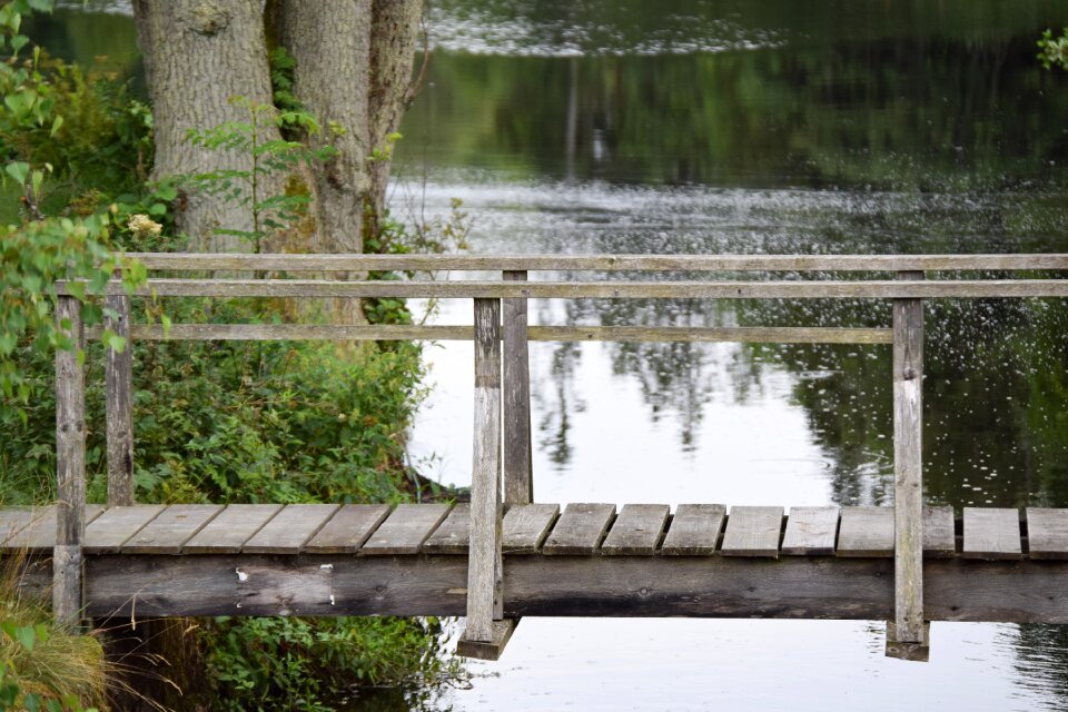 Still wooden bridge water