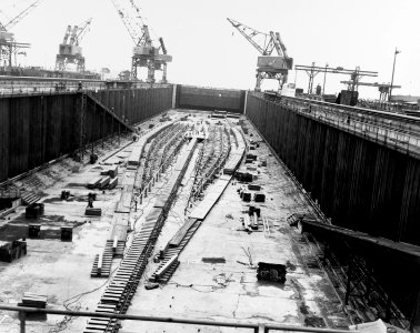 The keel plate of USS United States (CVA-58) being laid in a construction dry dock on 18 April 1948 photo