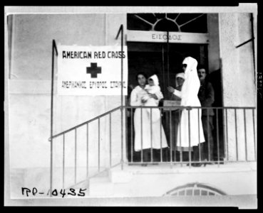 The Jr. Red Cross worker calls on a mother of one of the babies who are brought to the clinic in Athens LCCN2010650535