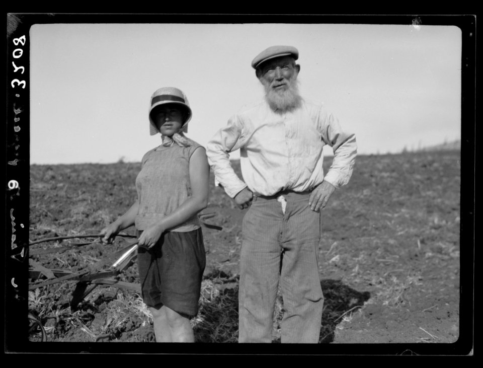 The Keren Hayesod. Agricultural Colonies on Plain of Esdraelon 'The Emek.' Zionist agricultural zeal. Grandfather helping grand-daughter to plow LOC matpc.15224