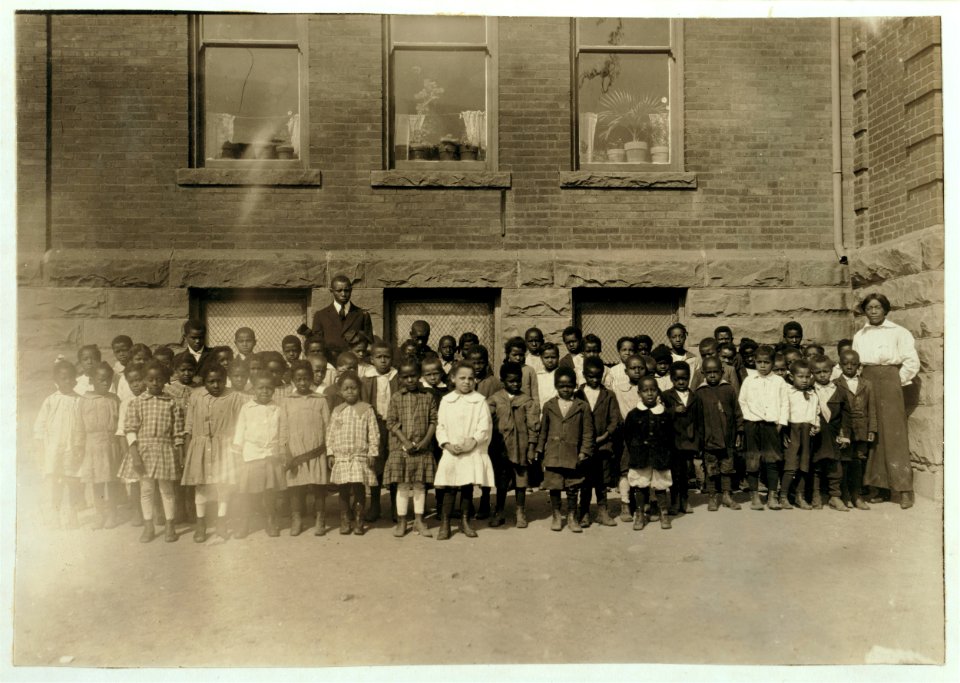 The lone teacher in charge of a room where 123 Kindergarten and First Grade children are enrolled. Dunbar School. Teacher said- 'There are only 70 here to-day. There must be an epidemic LOC nclc.00662