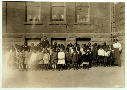 The lone teacher in charge of a room where 123 Kindergarten and First Grade children are enrolled. Dunbar School. Teacher said- 'There are only 70 here to-day. There must be an epidemic LOC nclc.00662