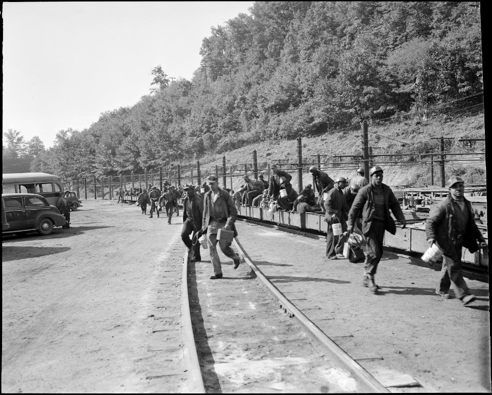 The man trip pulls in and the miners rush to check in their safety lamps and identification tags. The Pocahontas... - NARA - 541083