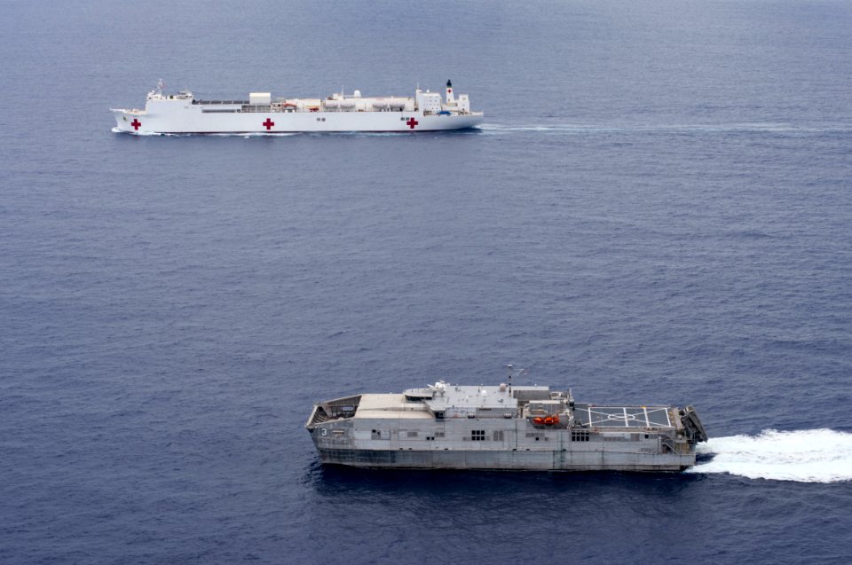 The Military Sealift Command hospital ship USNS Mercy (T-AH 19) and the Joint High Speed Vessel USNS Millinocket (JHSV 3) steam in formation during Pacific Partnership 2015 150527-N-BK290-816