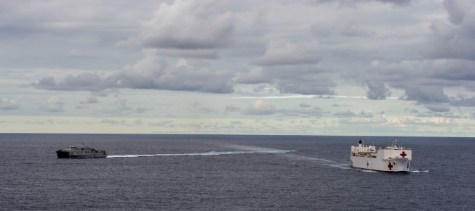 The Military Sealift Command hospital ship USNS Mercy (T-AH 19) and the Joint High Speed Vessel USNS Millinocket (JHSV 3) steam in formation during Pacific Partnership 2015 150527-N-BK290-716