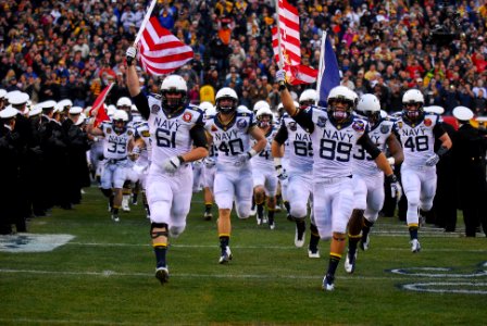 The Navy Midshipmen take the field.