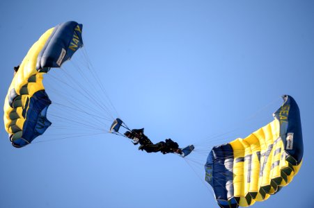 The Navy Leap Frogs make a parachute during the Army-Navy Game photo