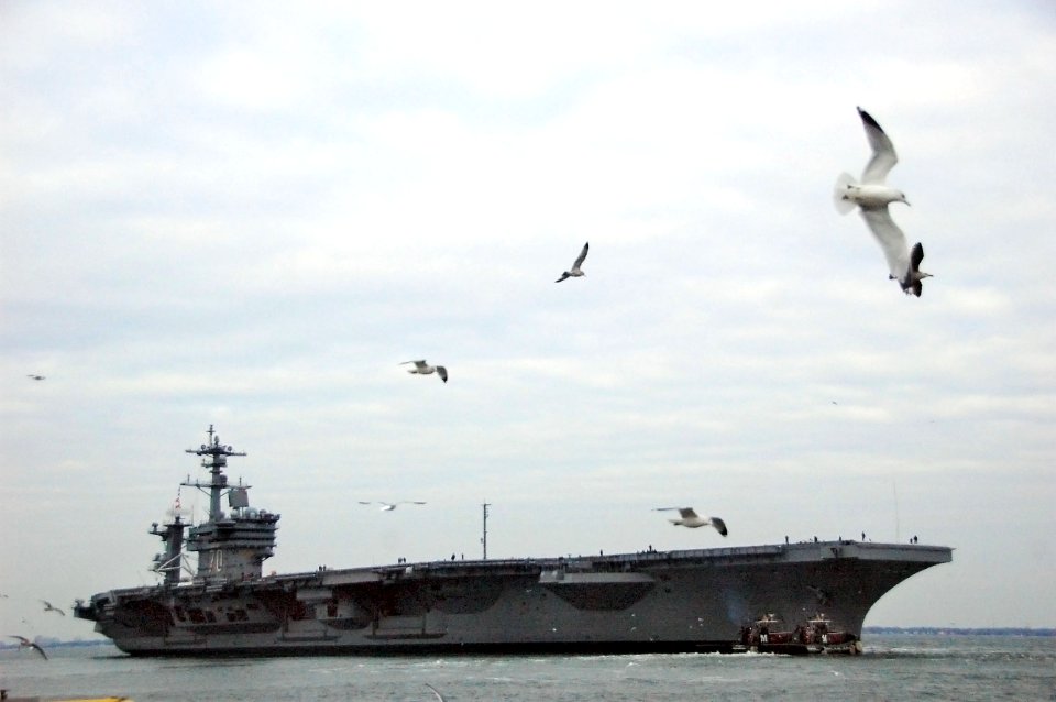 The Nimitz-class aircraft carrier USS Carl Vinson (CVN 70) departs Naval Station Norfolk, Va., Jan. 12, 2010