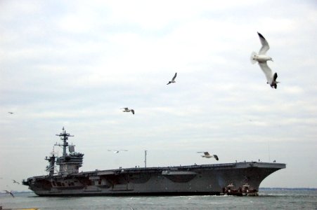 The Nimitz-class aircraft carrier USS Carl Vinson (CVN 70) departs Naval Station Norfolk, Va., Jan. 12, 2010