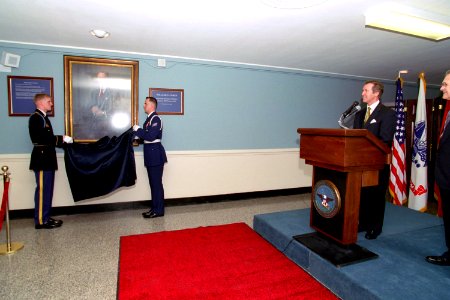 The official portrait of William Cohen is unveiled during a ceremony hosted by Donald Rumsfeld photo