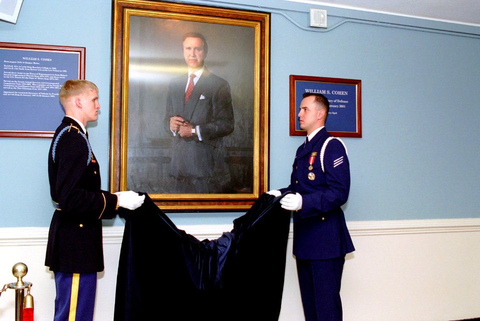 The official portrait of William Cohen is unveiled during a ceremony at the Pentagon