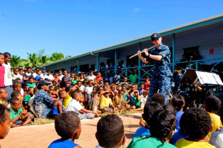 The Pacific Fleet Band entertains children in Savusavu, Fiji, during Pacific Partnership 2015 150612-N-HE318-060