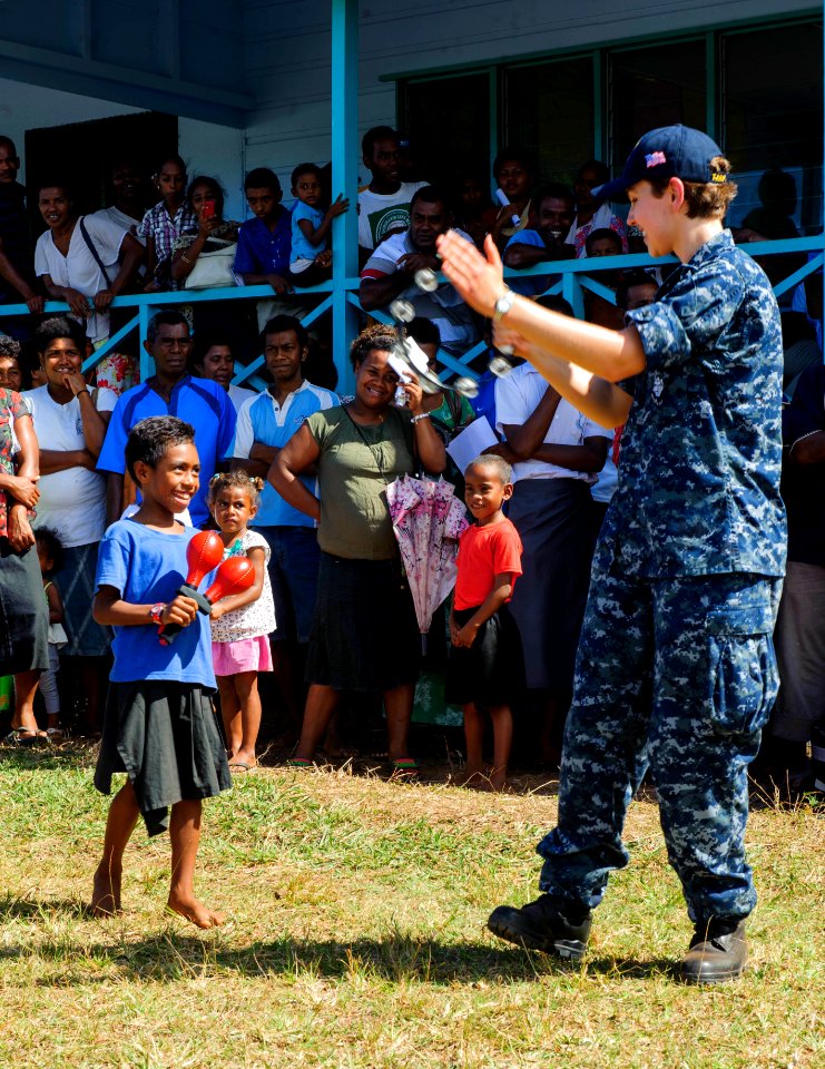 The Pacific Fleet Band entertains children in Savusavu, Fiji, during Pacific Partnership 2015 150612-N-HE318-158