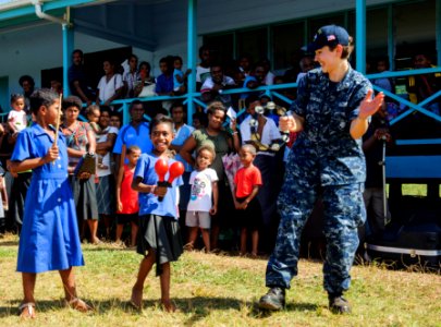 The Pacific Fleet Band entertains children in Savusavu, Fiji, during Pacific Partnership 2015 150612-N-HE318-131