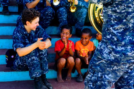The Pacific Fleet Band entertains children in Savusavu, Fiji, during Pacific Partnership 2015 150612-N-HE318-194