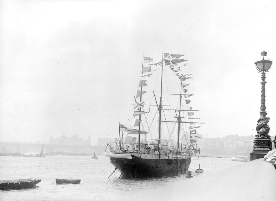 The RNVR Training Ship 'Buzzard' (1887) moored in the River Thames at the Embankment. RMG P00040