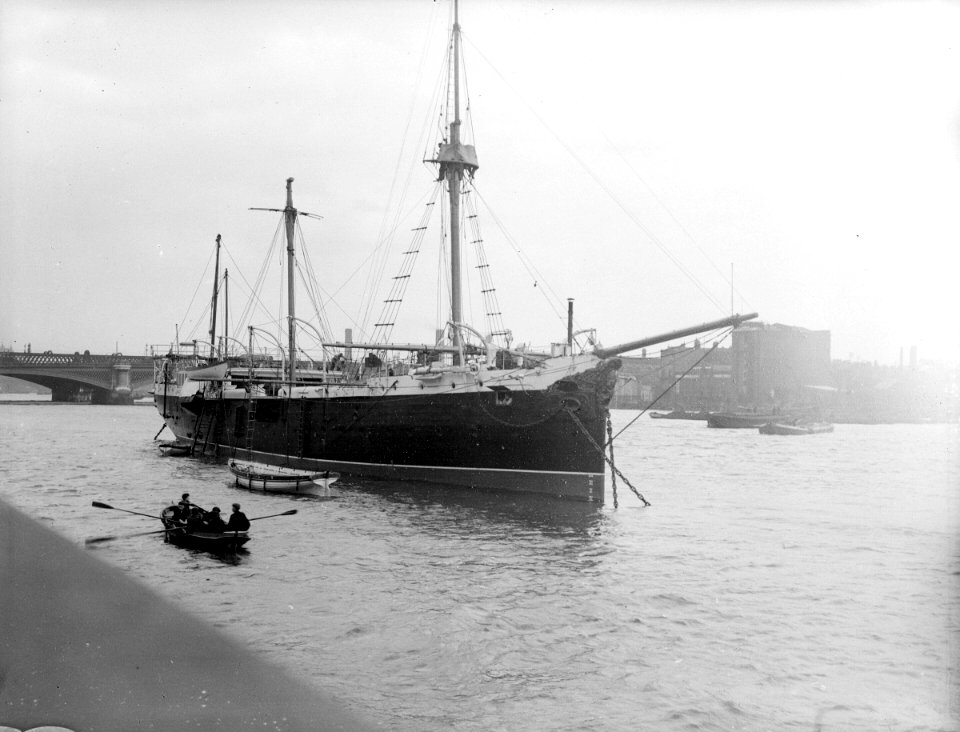 The RNVR Training Ship 'Buzzard' (1887) moored in the River Thames at the Embankment. RMG P00041