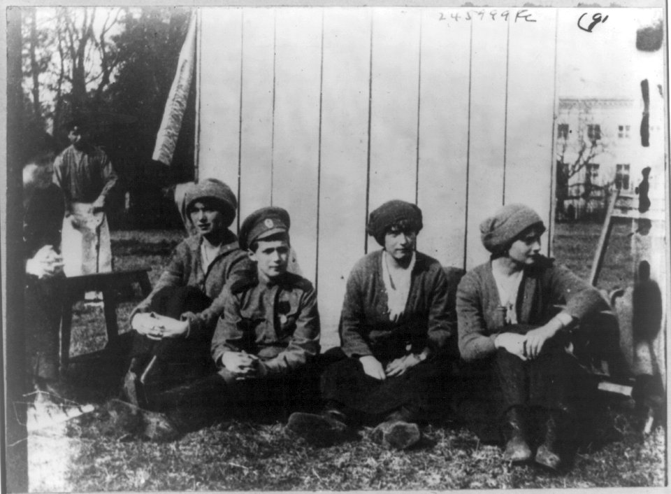 The Russian royal children resting after working in the garden at Tsarskoe Selo. Left to right- Olga Nicolaevna, Alexis Nicolaevitch, Anastasie and Tatiana Nicolaevna LCCN2007683271