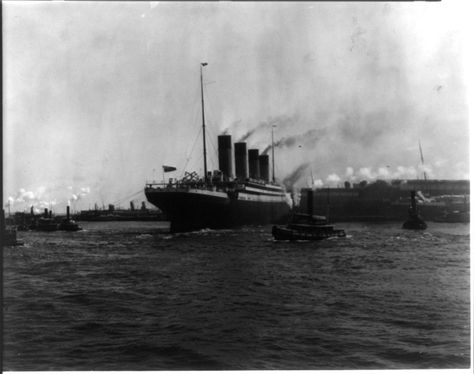 The S.S. OLYMPIC, 1911- Tugs maneuvering ship into pier, New York Harbor LCCN2002721364
