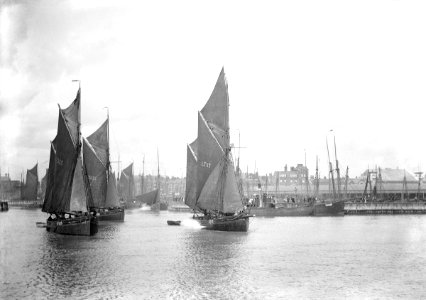 The sailing trawlers LT325, LT653 and LT37 leaving the outer harbour, taken from the end of the breakwater. RMG P27505