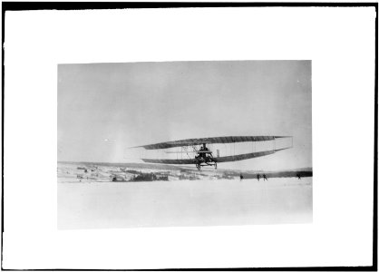 The Silver Dart, one of the Aerial Experiment Association's early airplanes, in flight over the frozen Bras d'Or Lake on Cape Breton Island LCCN00650256