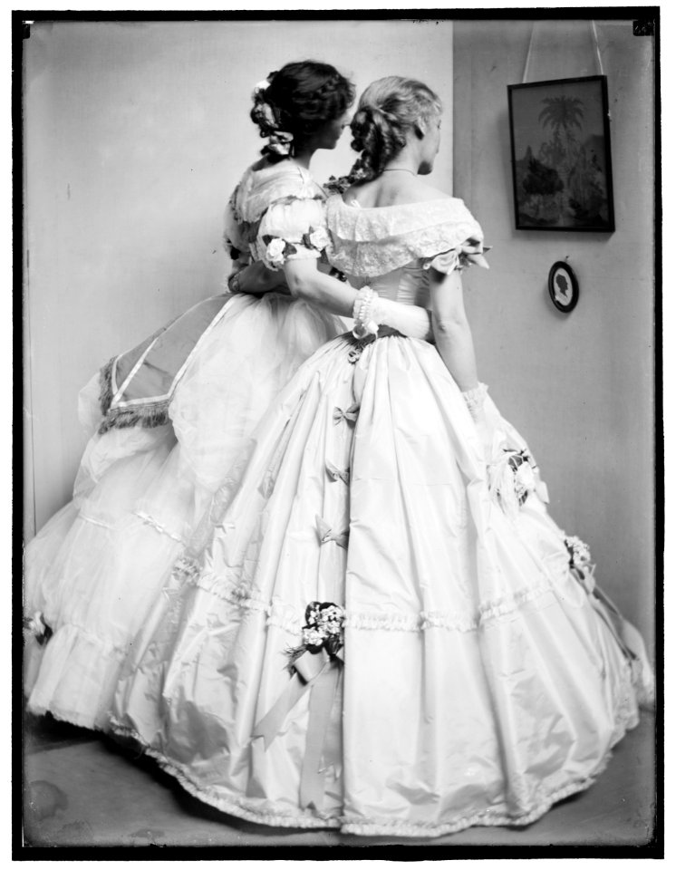 The silhouette, a study posed by the Gerson sisters in their Crinoline Ball costumes LCCN2006684237